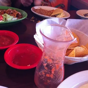 Salsa carafe, salsa bowls, chips. Mostly eaten. Good.