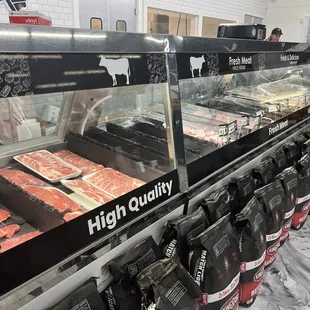 a display of meat in a display case