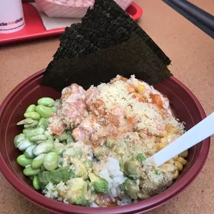 White rice, spicy salmon and spicy tuna, edamame, corn, avocado, tempera crunch  with toro and yum yum sauce