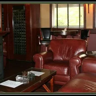 a living room with leather furniture