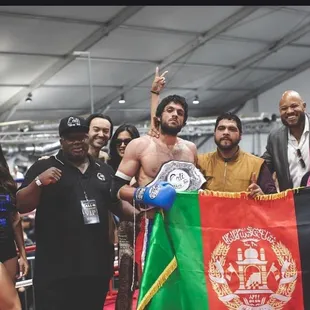 Idrees Bahrami Winning his second Amateur World Champion Title with his coach Ignacio Zambrano sponsored by Mongkol Muay Thai &amp; AllOut