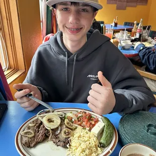 Carne Asada, rice, beans, vegetable salad.
