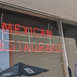 a neon sign in the window