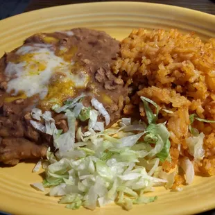 Side of rice and beans. Both tasted like stale leftovers reheated under a broiler.