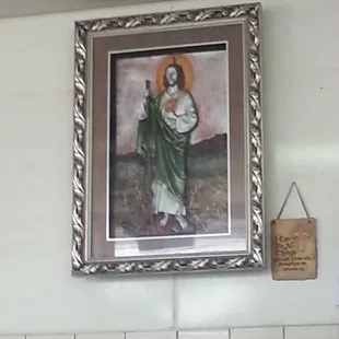 a painting of jesus on a wall
