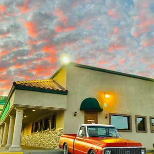 a truck parked in front of a building