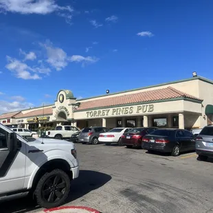a parking lot with cars parked in front of it