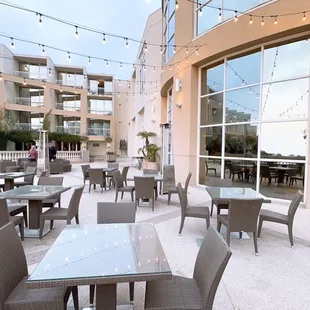 outdoor dining area with tables and chairs