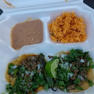 a person holding a container of food