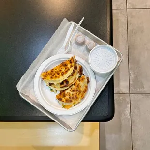 a plate of quesadillas on a table
