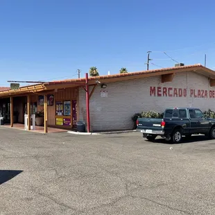 a truck parked in front of a restaurant