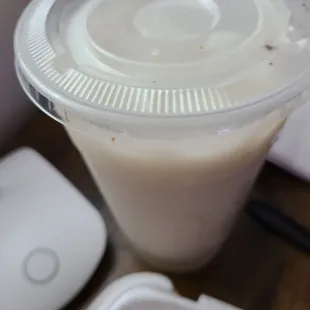 a smoothie in a plastic cup