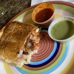 Torta with chicken, chorizo, onions and queso.   The homemade sauces are FIRE!!!