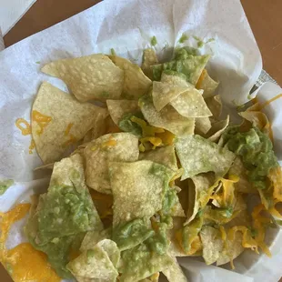 This was the &quot; chips with cheese and guacamole&quot; idk if you can call that cheese or guacamole