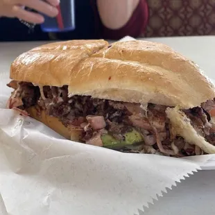 "La Deliciosa". This one is their signature sandwich. Paired with their michelada