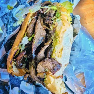 a sandwich with meat and lettuce