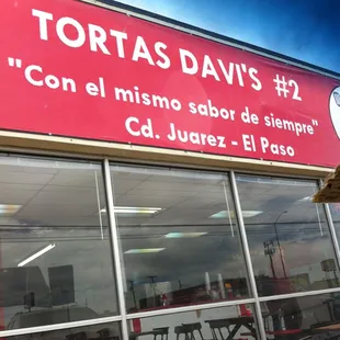 a sign in front of a restaurant