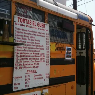 a yellow bus with a menu on the side
