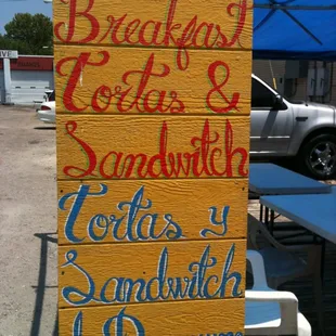 a sign for breakfast and sandwich