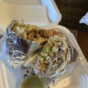 a burrito in a styrofoam container