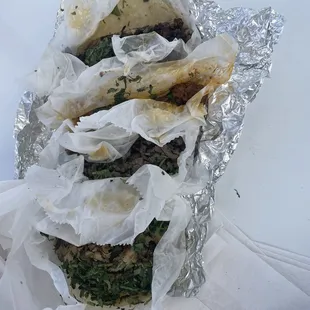 Carnitas, steak, chicken and fried pork tacos