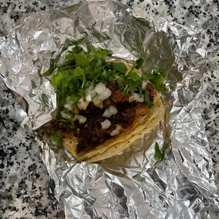 a tortilla wrapped in foil