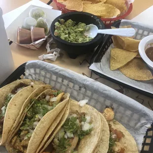 Fish taco, chicken taco, shrimp taco, el pastor (pork) taco and chips, salsa and guacamole
