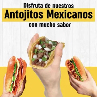 two hands holding two tacoss