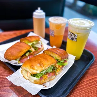 two sandwiches and a drink