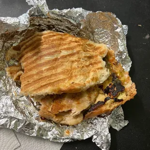 a sandwich wrapped in tin foil