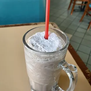 a drink in a glass with a straw