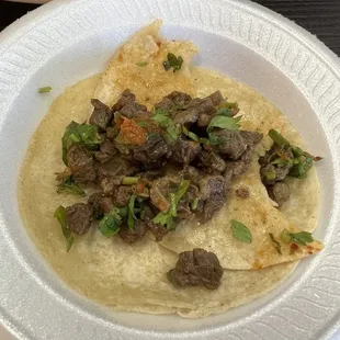 Asada taco. One bite taken.