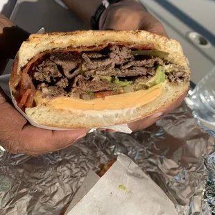 #14, steak and bacon with everything (jalapeños, avocado, cheese, mayo, tomato and onion). One sandwich can easily feed two people.