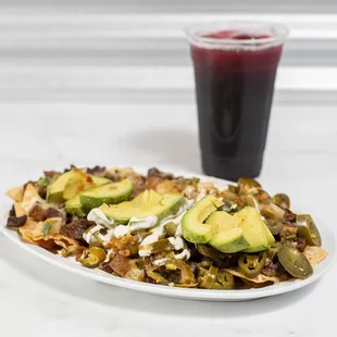 Super carne asada nachos with hibiscus agua Fresca