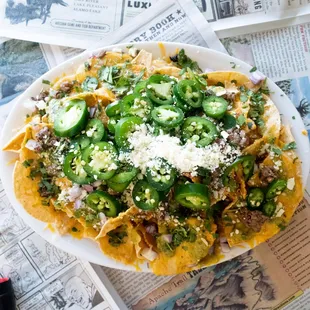 Feast on our nachos with homemade queso