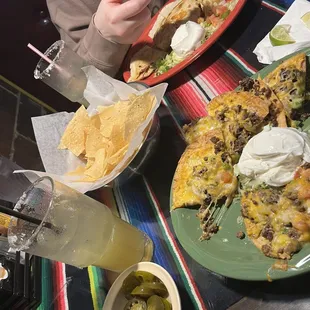 Beef nachos-bottom, chicken quesadilla-top.