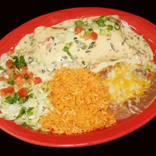 Tender chunk pork burrito with espinaca dip on top