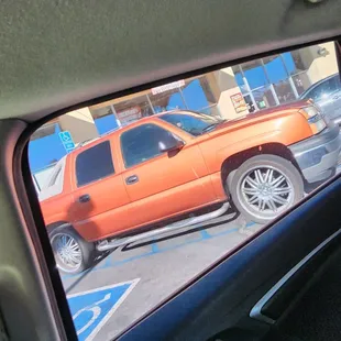 The truck was parked in the middle of two handicap spots I wad parked on the driver side