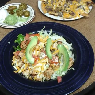 Blackened chicken salad and lunch fajita nachos.