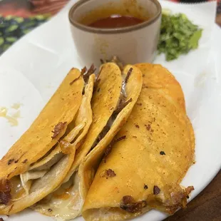 Quesabrilla tacos with side of dipping broth