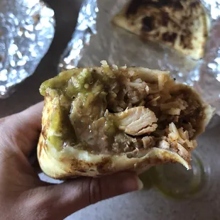 Chicken burrito featuring the delicious green chilies salsa and half a chicken quesadilla