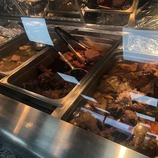 Rt-Lt carnitas, barbacoa, sopa de res and empty pans where the rotisserie and fried chicken would be. I got all 3 pictured