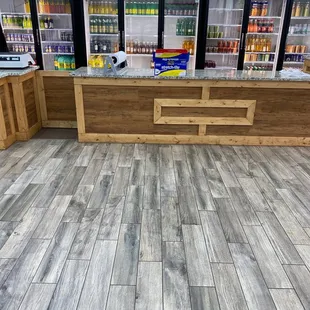 Clean checkout area with variety of Hispanic drinks