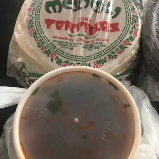Fresh hot corn tortillas with their homemade salsa.