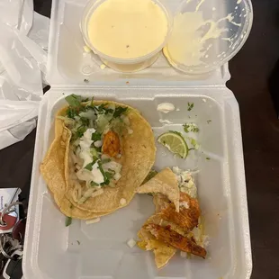 Fish and shrimp tacos and I got chips and queso