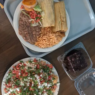 Tamales meal, chicken nachos, and chocolate cake.