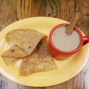 a plate of tortillas and a cup of quesadilla