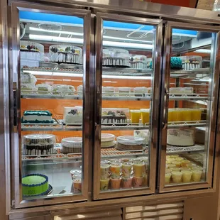 a man standing in front of a refrigerator
