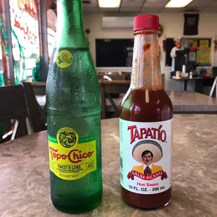 two bottles of taco sauce