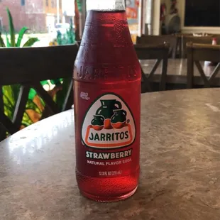 a bottle of strawberry soda
